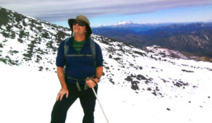 Dan Tormey hiking a snowy mountain