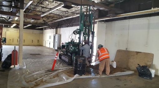 a few men working in a building