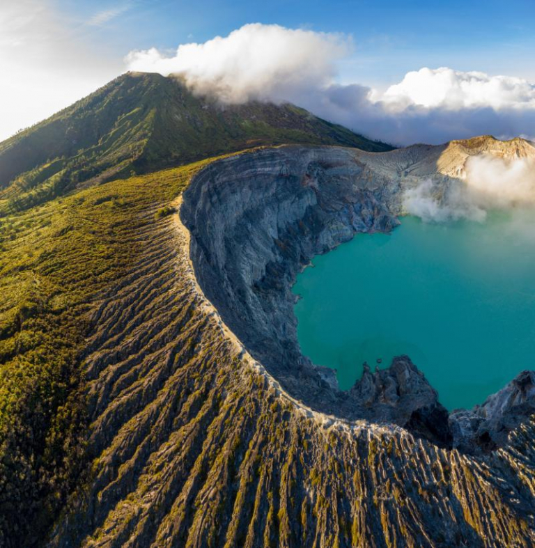 a mountain with a lake and a mountain in the background