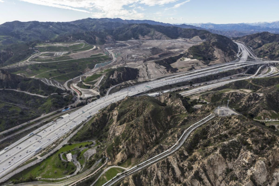 Cars driving on a highway in the mountains