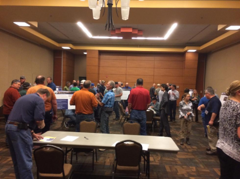 a group of people in a conference room