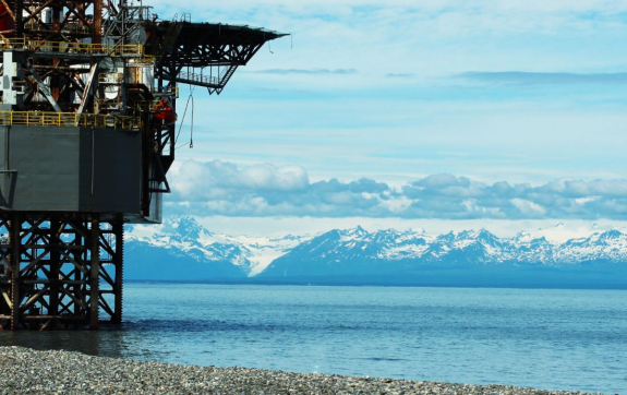 a large offshore rig on a rocky shore