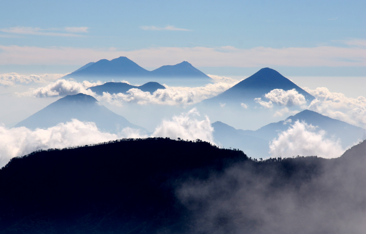 a mountain range with clouds