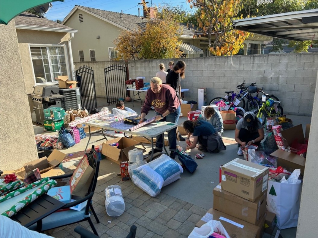 Catalyst employees working to wrap toys and necessities going to families in need