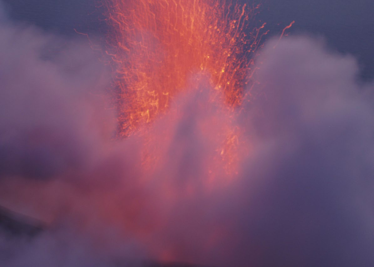 a volcano erupting with smoke